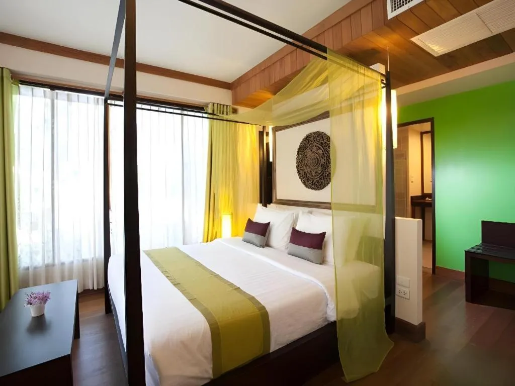 Bed in Baan Talay Dao Resort
