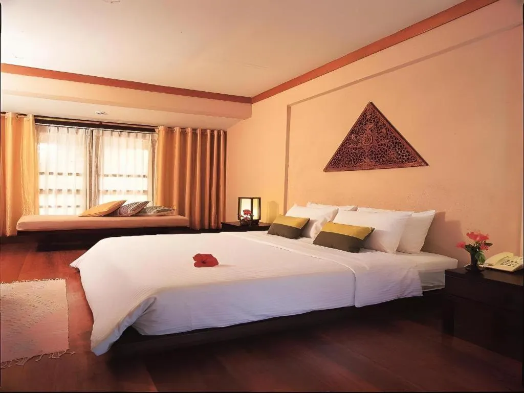 Bed in Baan Talay Dao Resort