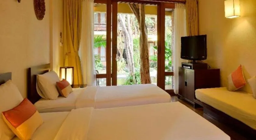 Bed in Baan Talay Dao Resort