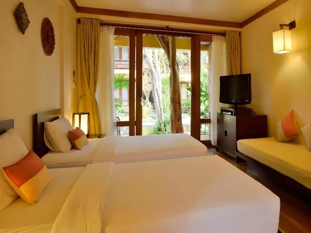 Bed in Baan Talay Dao Resort