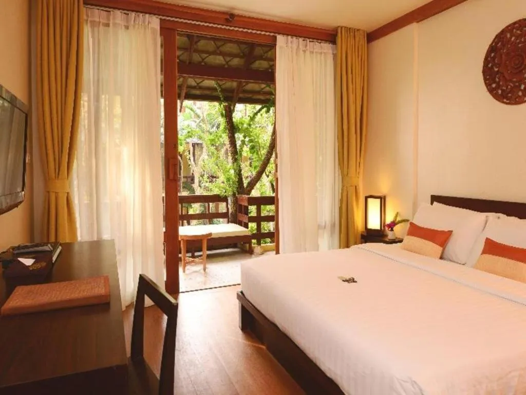 Bed in Baan Talay Dao Resort