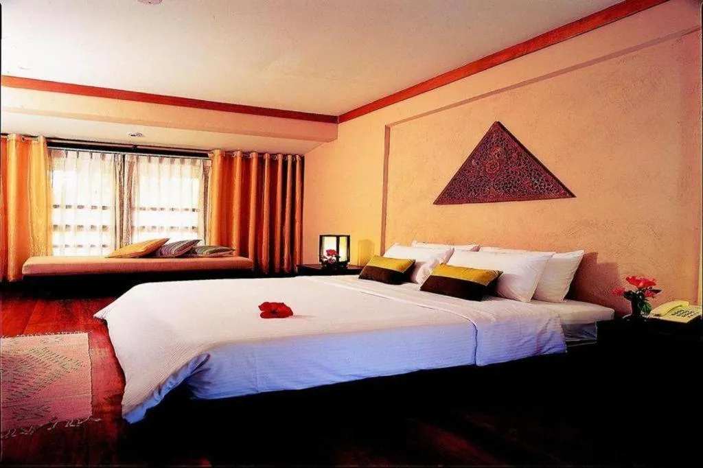 Bed in Baan Talay Dao Resort