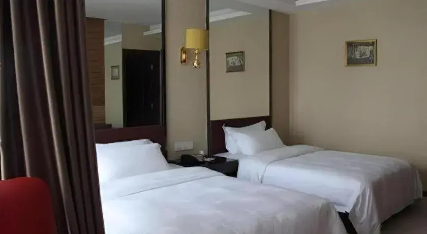 Bed in Milu Hotel Bed in Milu Hotel