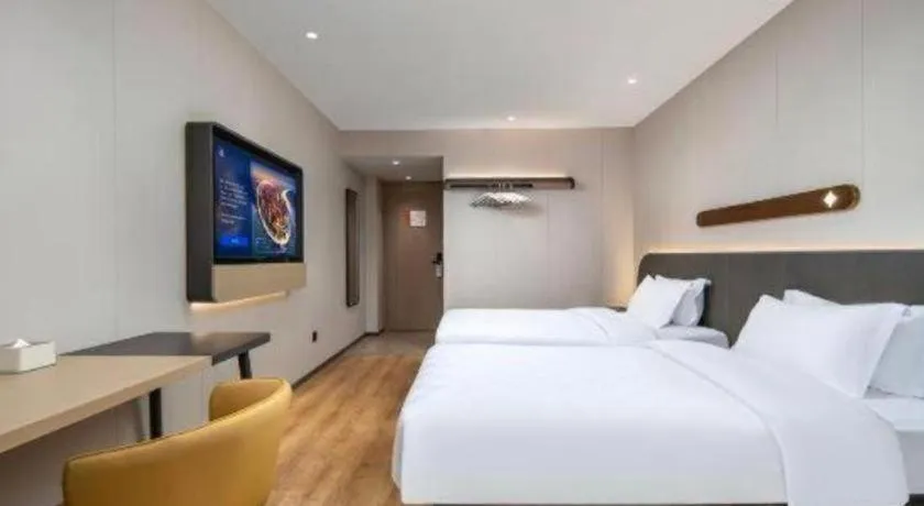 Bed in Jinjiang Inn Zhuhai Xiangzhou Qinglv Middle Road Theater