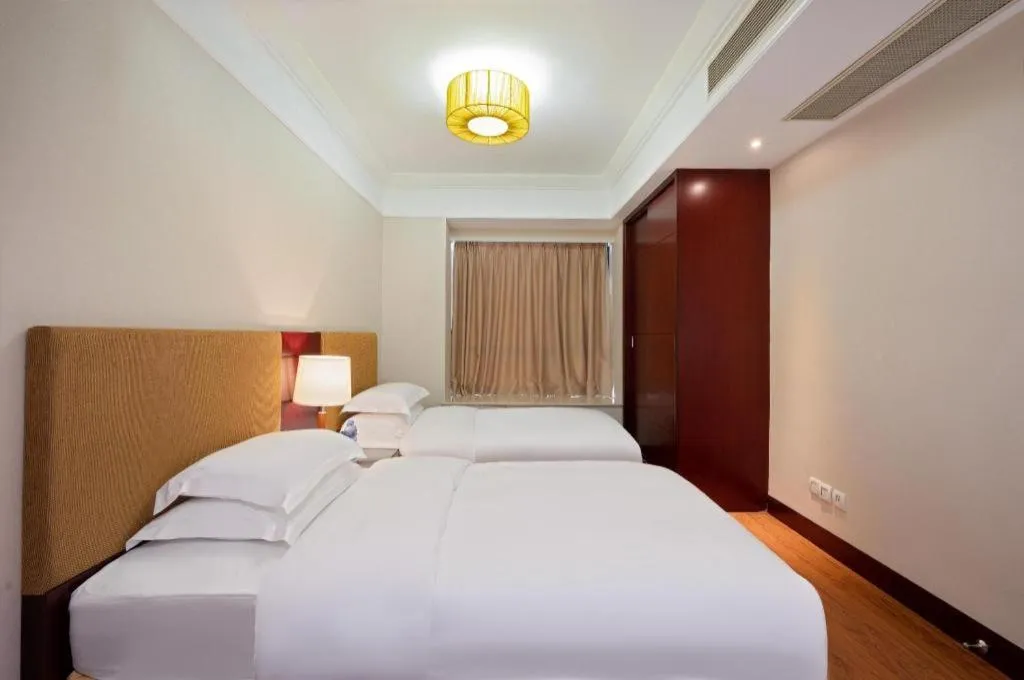 Bed in Golden Diamond Hotel Zhongshan