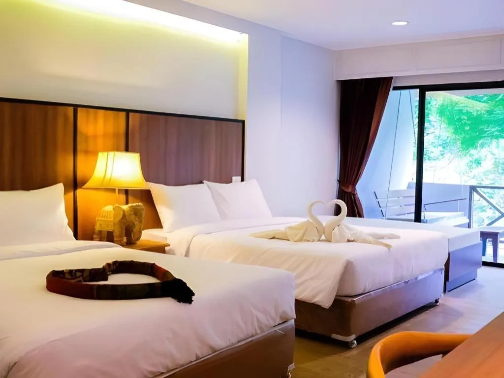 Bed in River Kwai Village Hotel