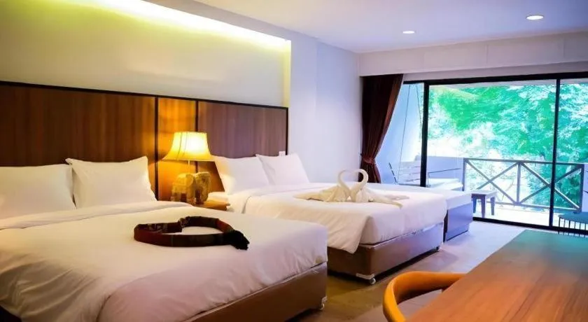 Bed in River Kwai Village Hotel