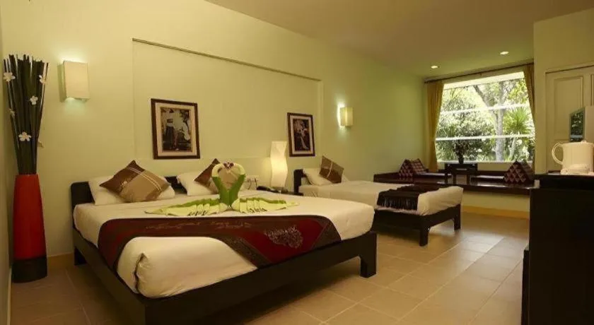 Bed in River Kwai Village Hotel