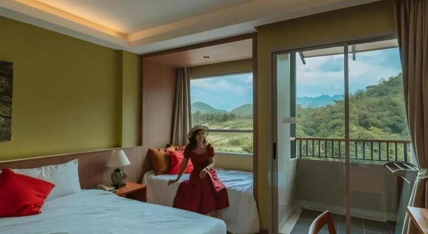 Bed in River Kwai Village Hotel