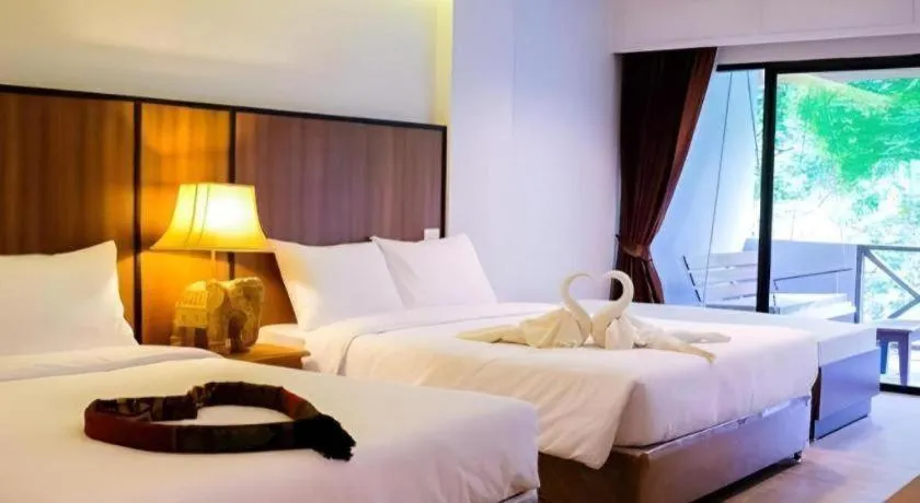 Bed in River Kwai Village Hotel