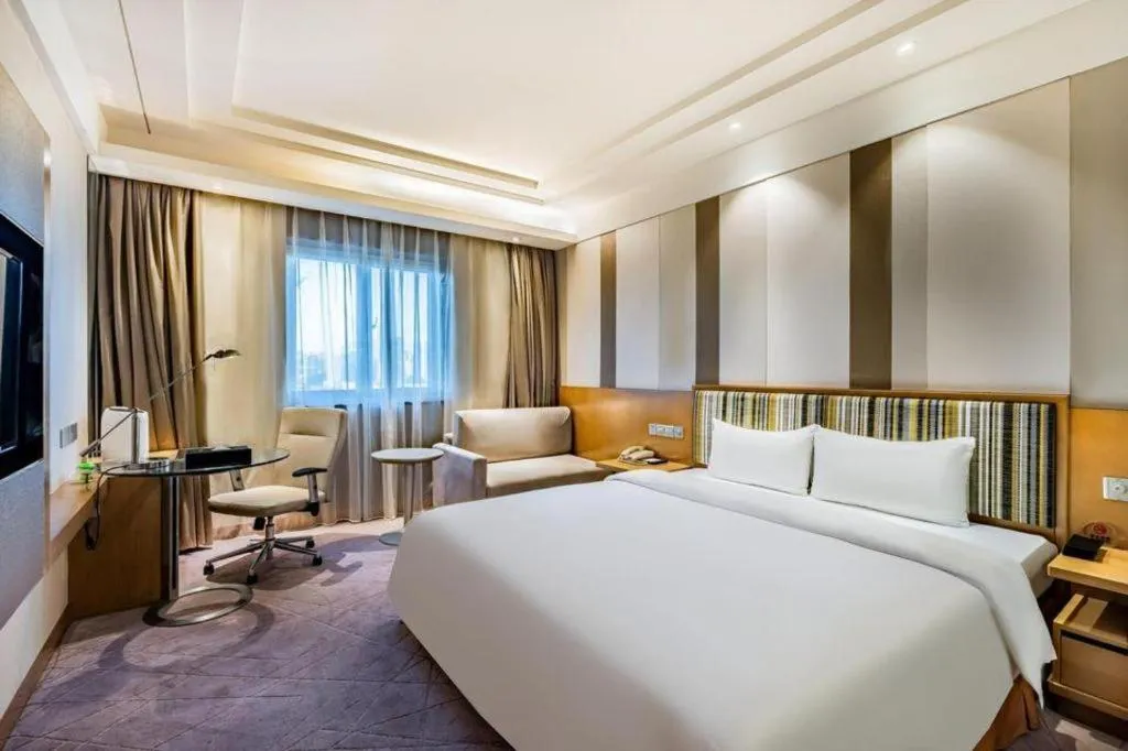 Bed in Grand Skylight Catic Hotel