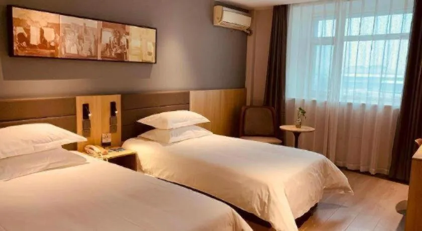 Bed in Jinjiang Inn Jiaxing South Lake