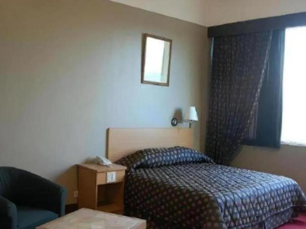 Bed in Great Eastern Hotel Quezon City