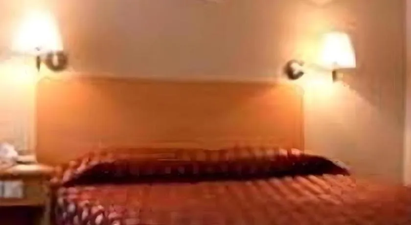 Bed in Great Eastern Hotel Quezon City