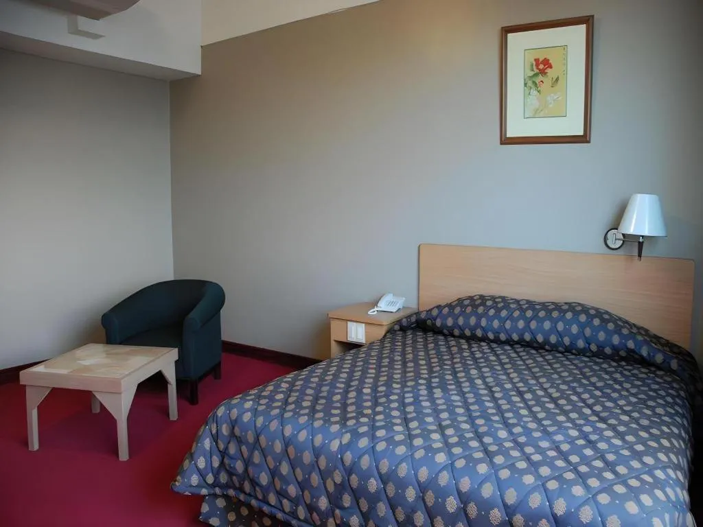 Bed in Great Eastern Hotel Quezon City