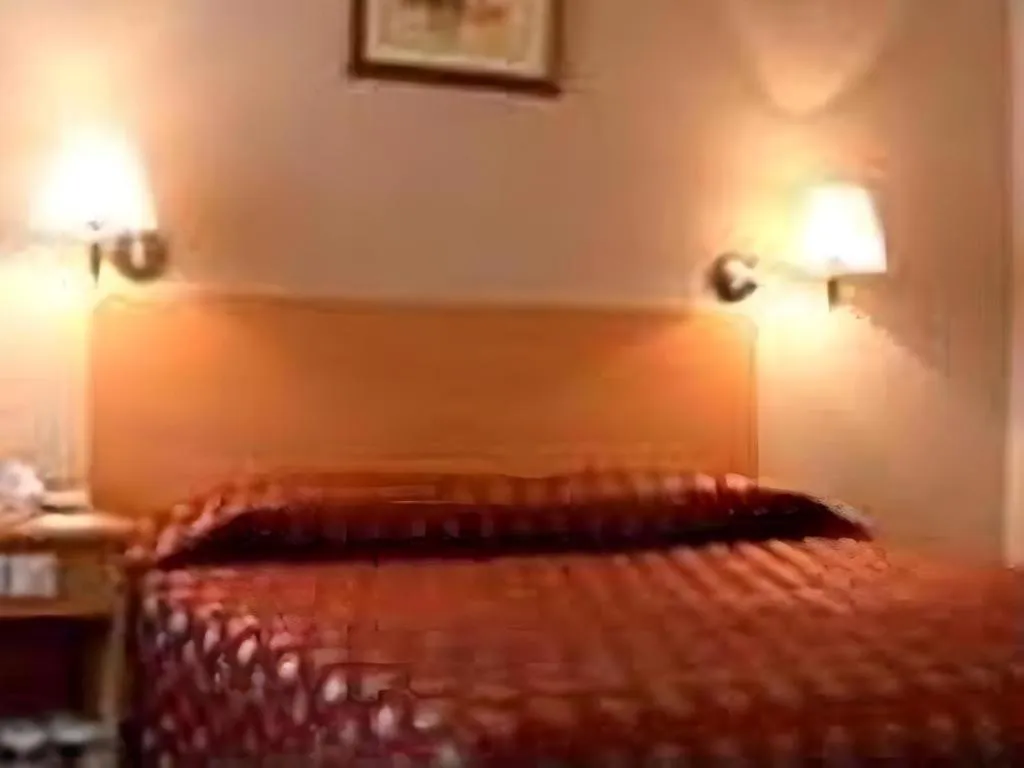 Bed in Great Eastern Hotel Quezon City