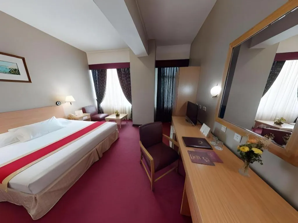 Bed in Great Eastern Hotel Quezon City