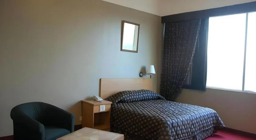 Bed in Great Eastern Hotel Quezon City