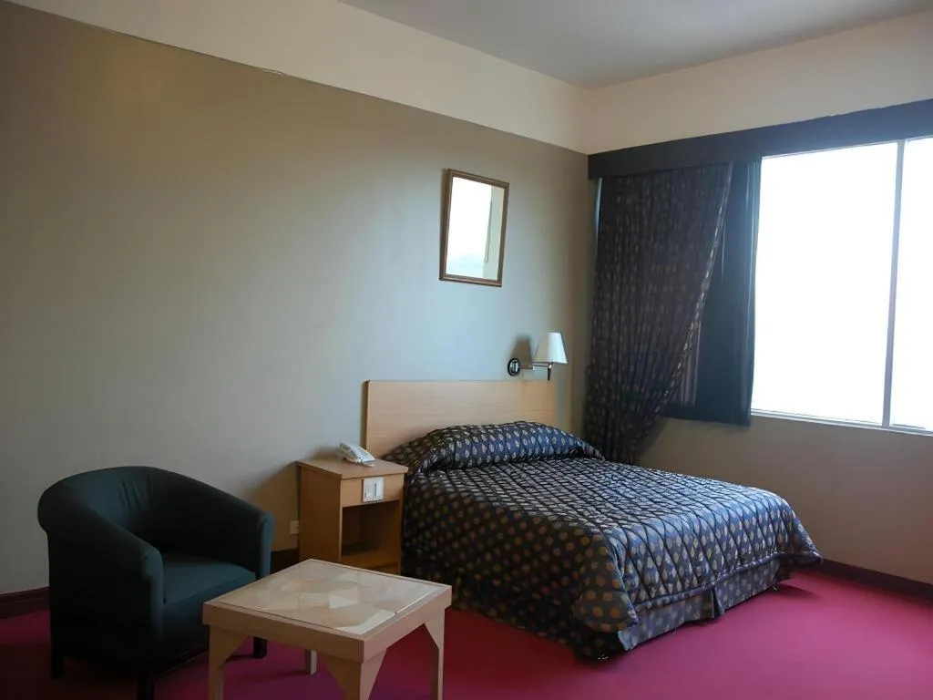 Bed in Great Eastern Hotel Quezon City