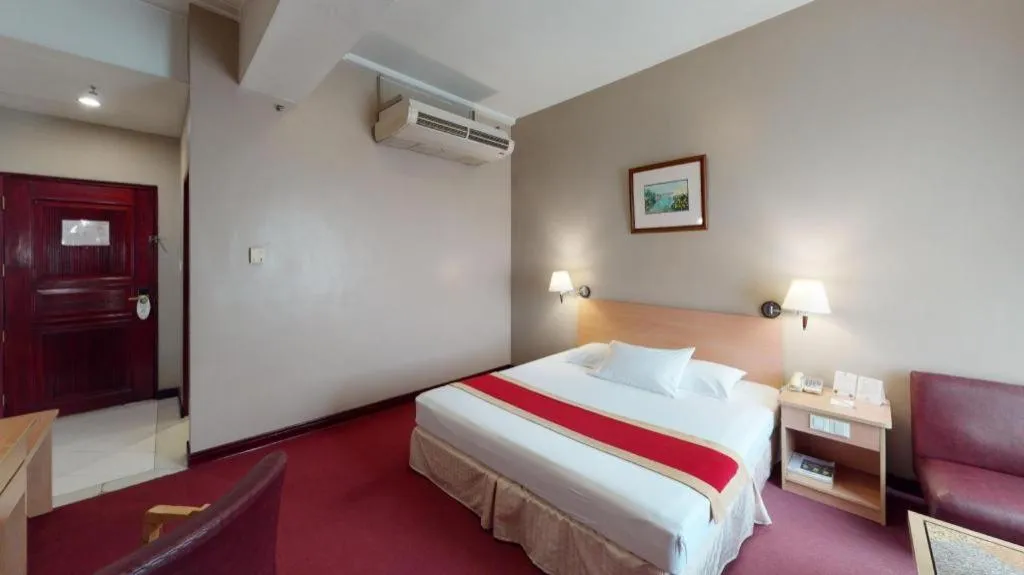Bed in Great Eastern Hotel Quezon City