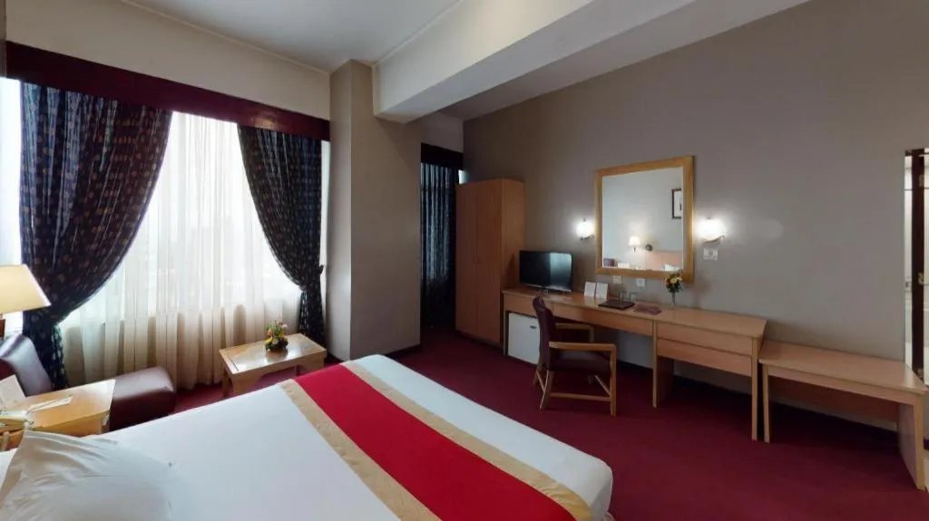 Bed in Great Eastern Hotel Quezon City