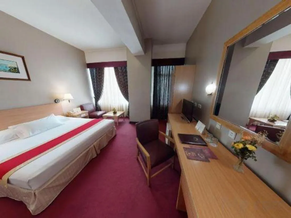 Bed in Great Eastern Hotel Quezon City