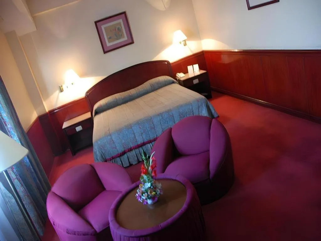 Bed in Great Eastern Hotel Quezon City