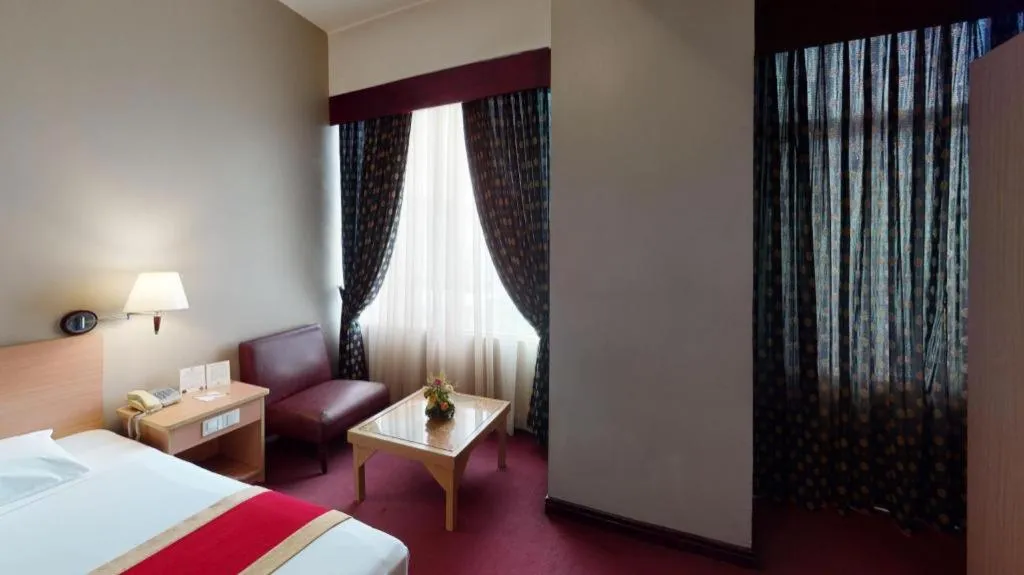 Bed in Great Eastern Hotel Quezon City