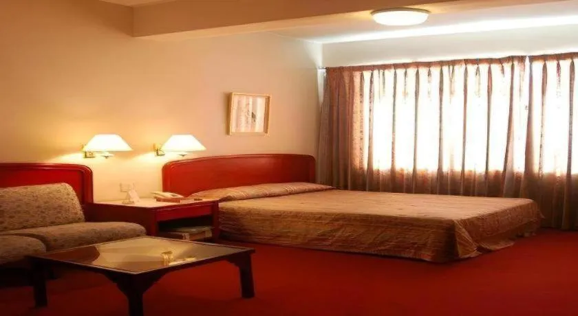 Bed in Great Eastern Hotel Quezon City