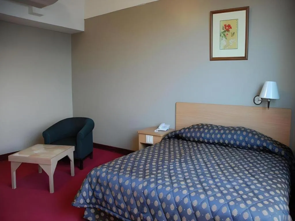 Bed in Great Eastern Hotel Quezon City