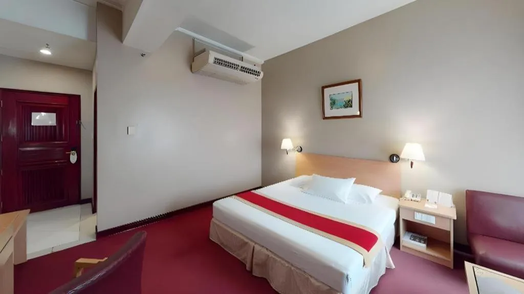 Bed in Great Eastern Hotel Quezon City