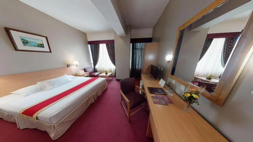 Bed in Great Eastern Hotel Quezon City