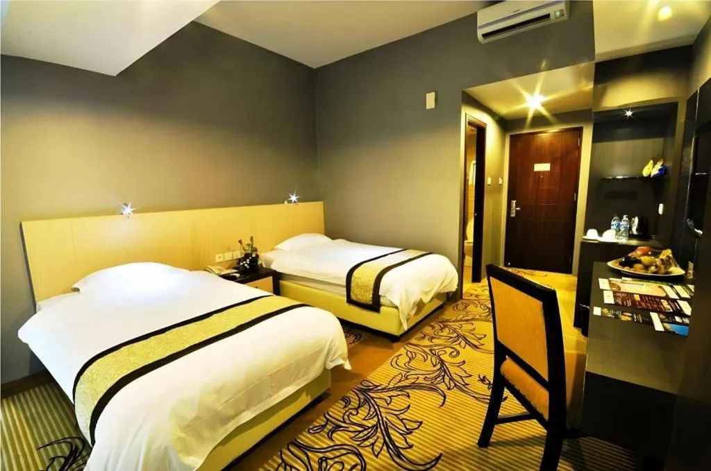 Bed in Hermes Palace Hotel Medan