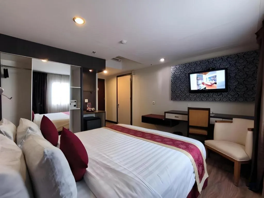 Bed in Hermes Palace Hotel Medan