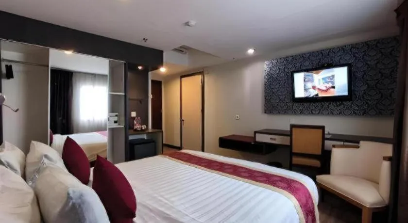 Bed in Hermes Palace Hotel Medan