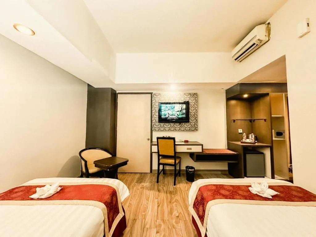 Bed in Hermes Palace Hotel Medan