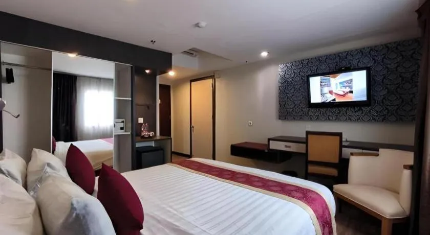 Bed in Hermes Palace Hotel Medan