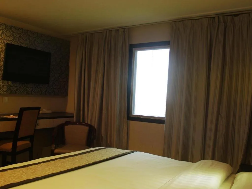 Bed in Hermes Palace Hotel Medan