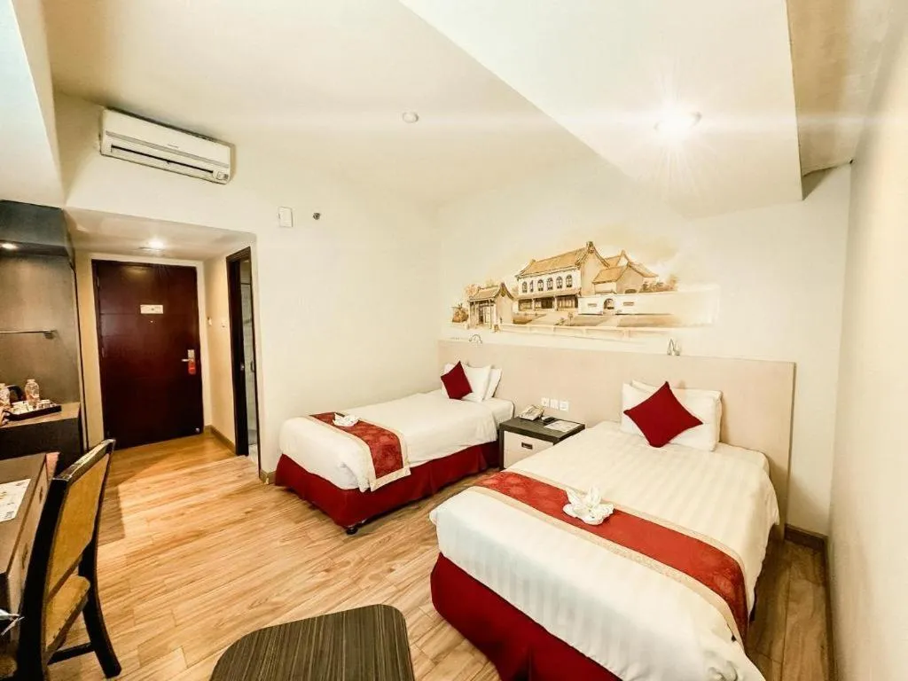 Bed in Hermes Palace Hotel Medan