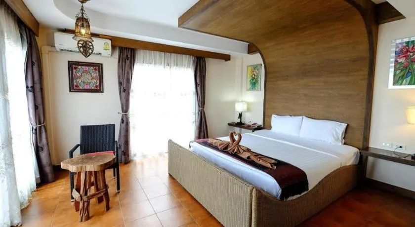 Bed in Red Balcony Hotel