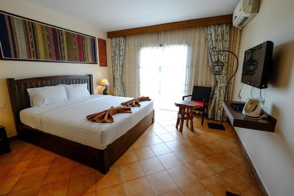 Bed in Red Balcony Hotel