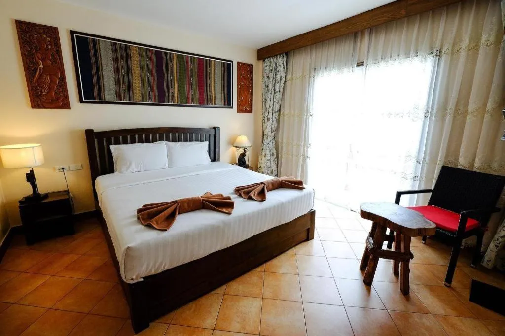 Bed in Red Balcony Hotel