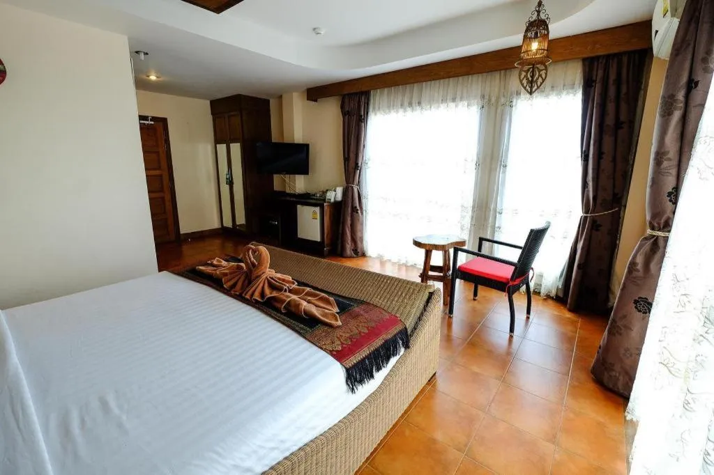 Bed in Red Balcony Hotel