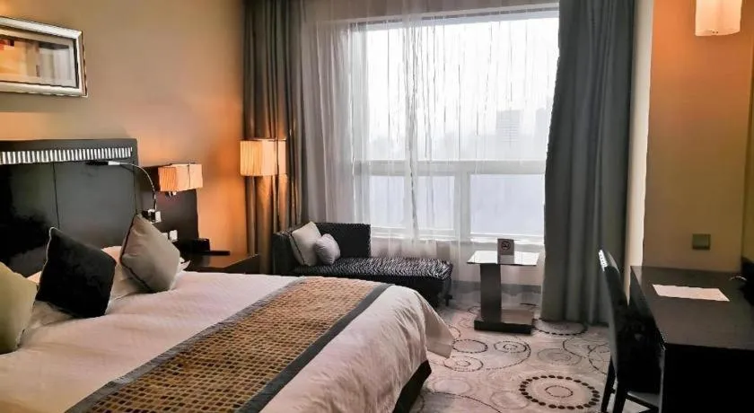 Bed in Grand Soluxe Zhongyou Hotel