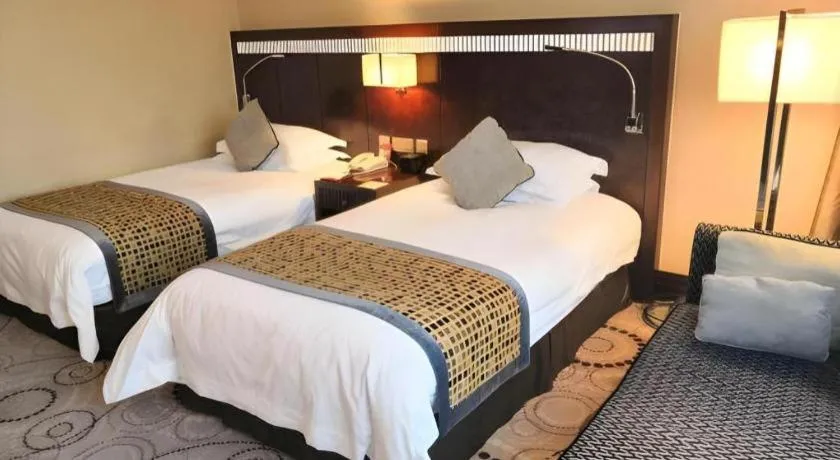 Bed in Grand Soluxe Zhongyou Hotel