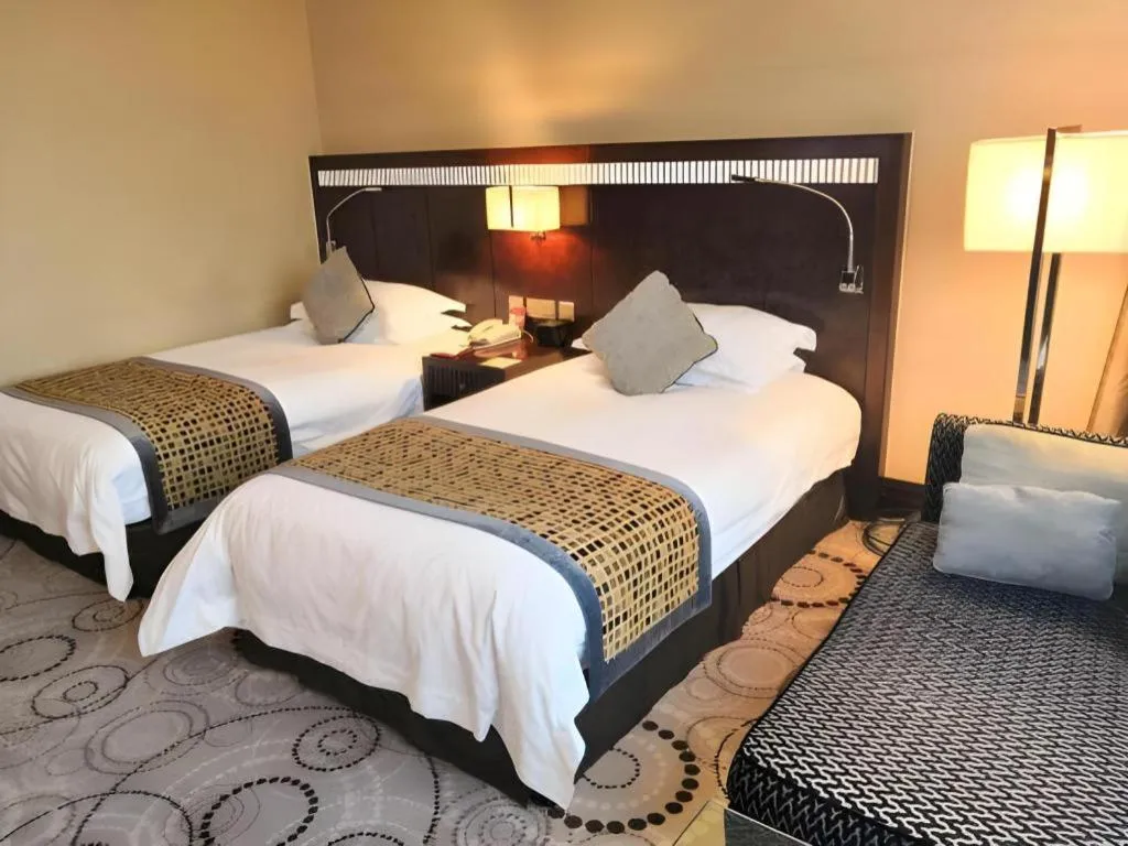 Bed in Grand Soluxe Zhongyou Hotel