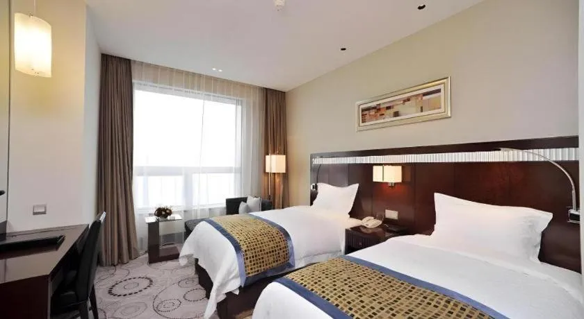 Bed in Grand Soluxe Zhongyou Hotel