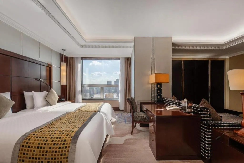 Bed in Grand Soluxe Zhongyou Hotel