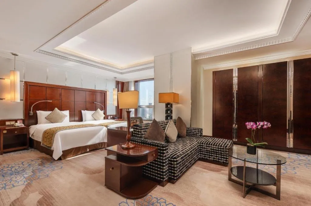 Bed in Grand Soluxe Zhongyou Hotel