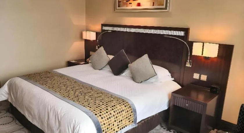 Bed in Grand Soluxe Zhongyou Hotel